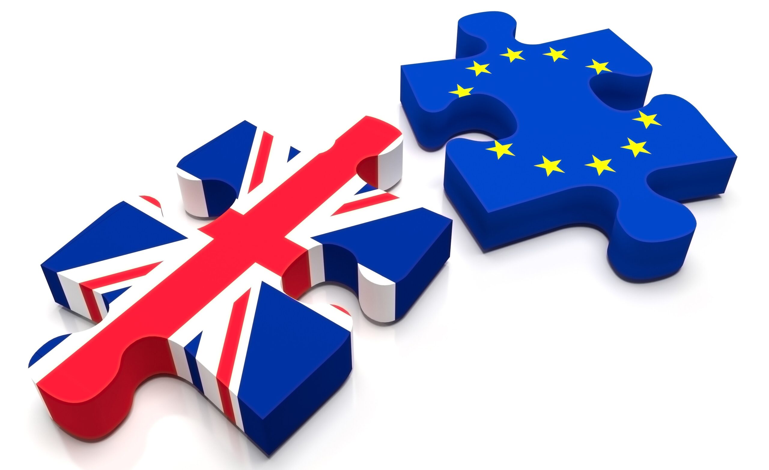 Two separate puzzle pieces with the British and EU flag represent the separation between the United Kingdom and the European Union.