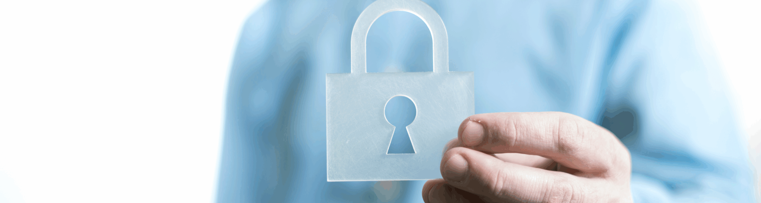 Hand holds a transparent lock in front of the chest, symbolizing digital security, privacy and protection of online payments.